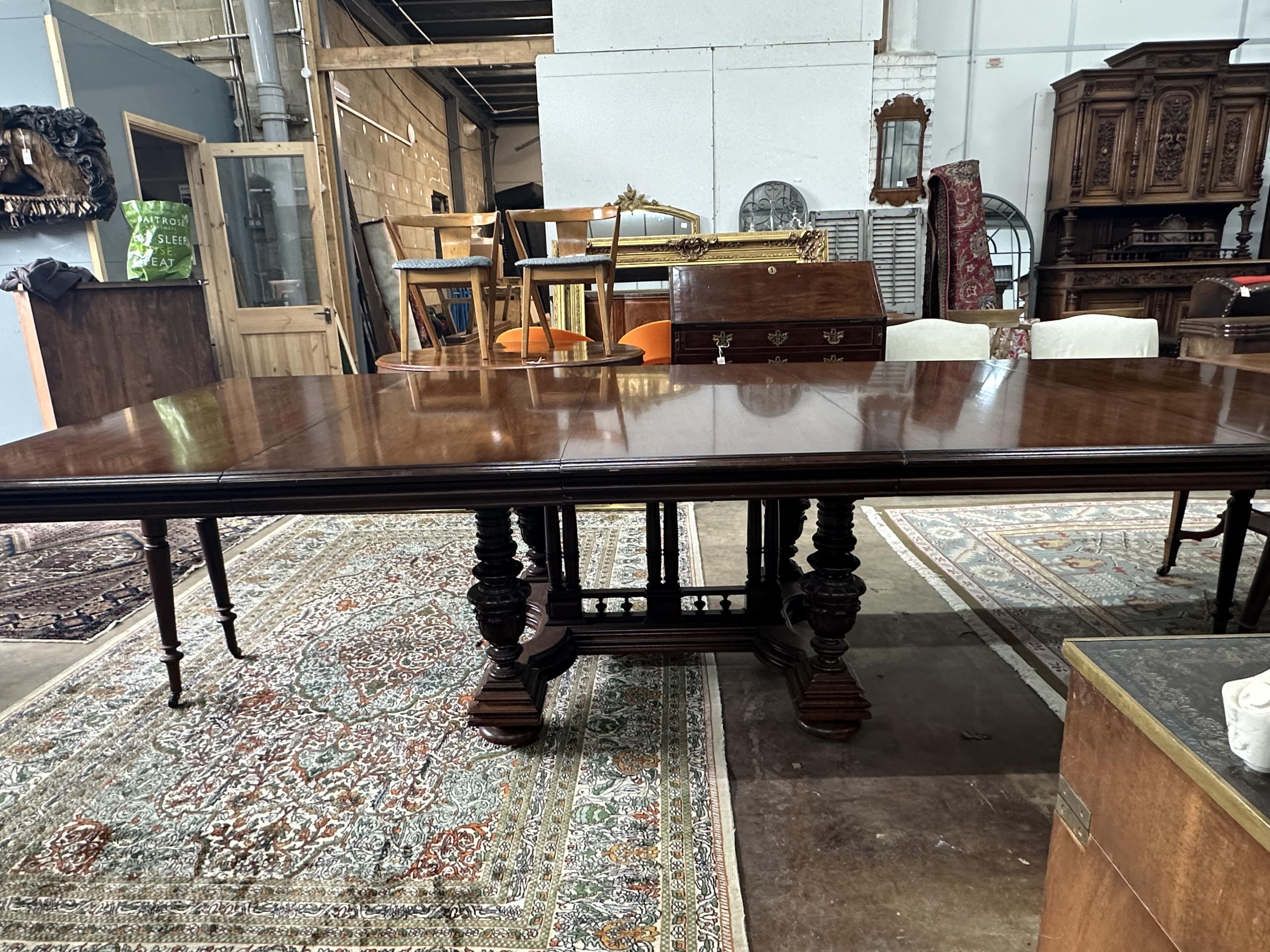 A reproduction French mahogany extending dining table, length 304cm extended, depth 128cm, height 74cm. Condition - good